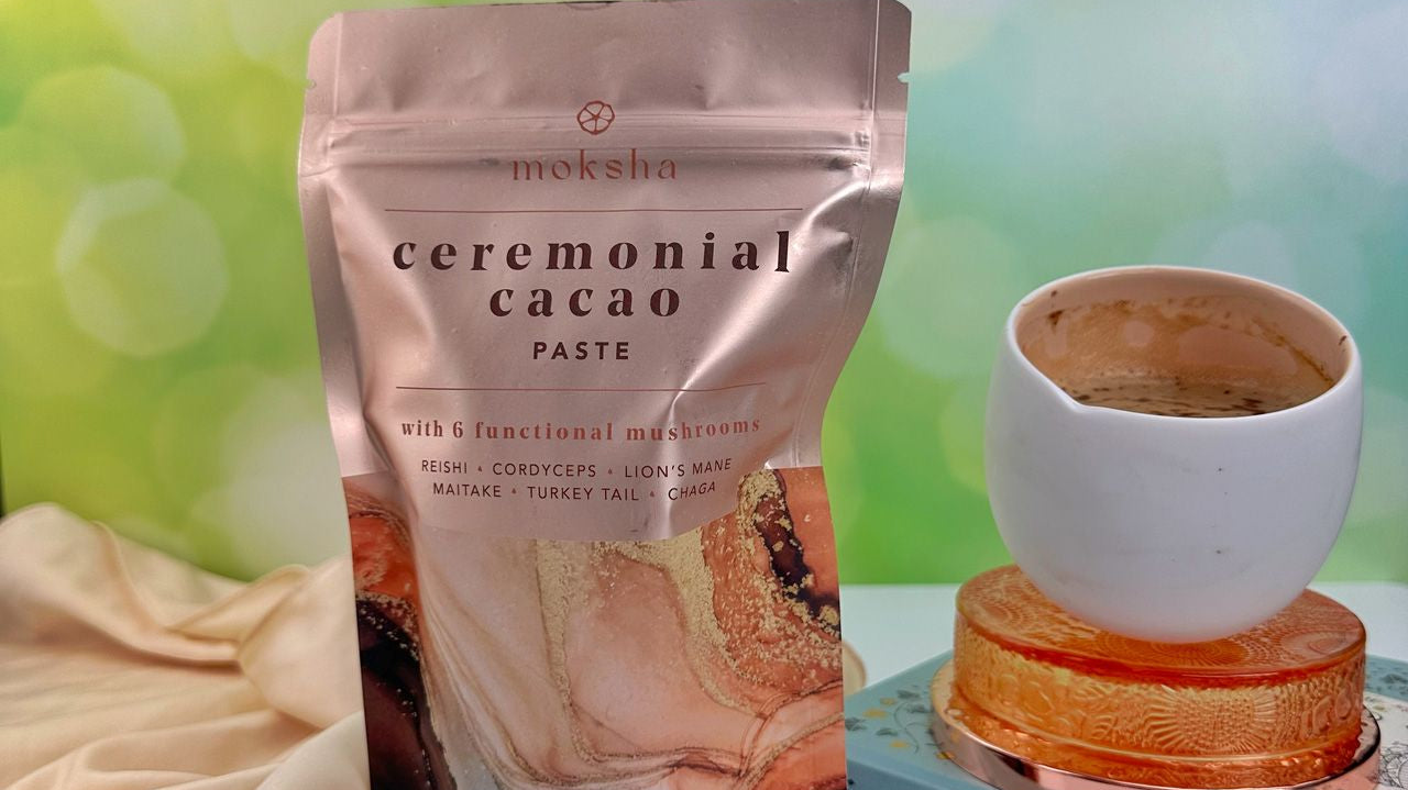 Moksha functional mushroom cacao with a white cacao cup