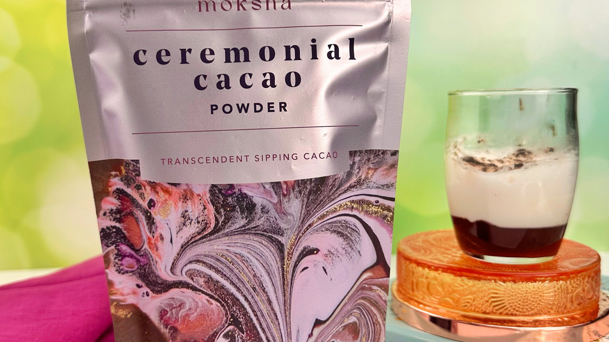 Moksha organic ceremonial cacao powder in a bowl with cacao beans