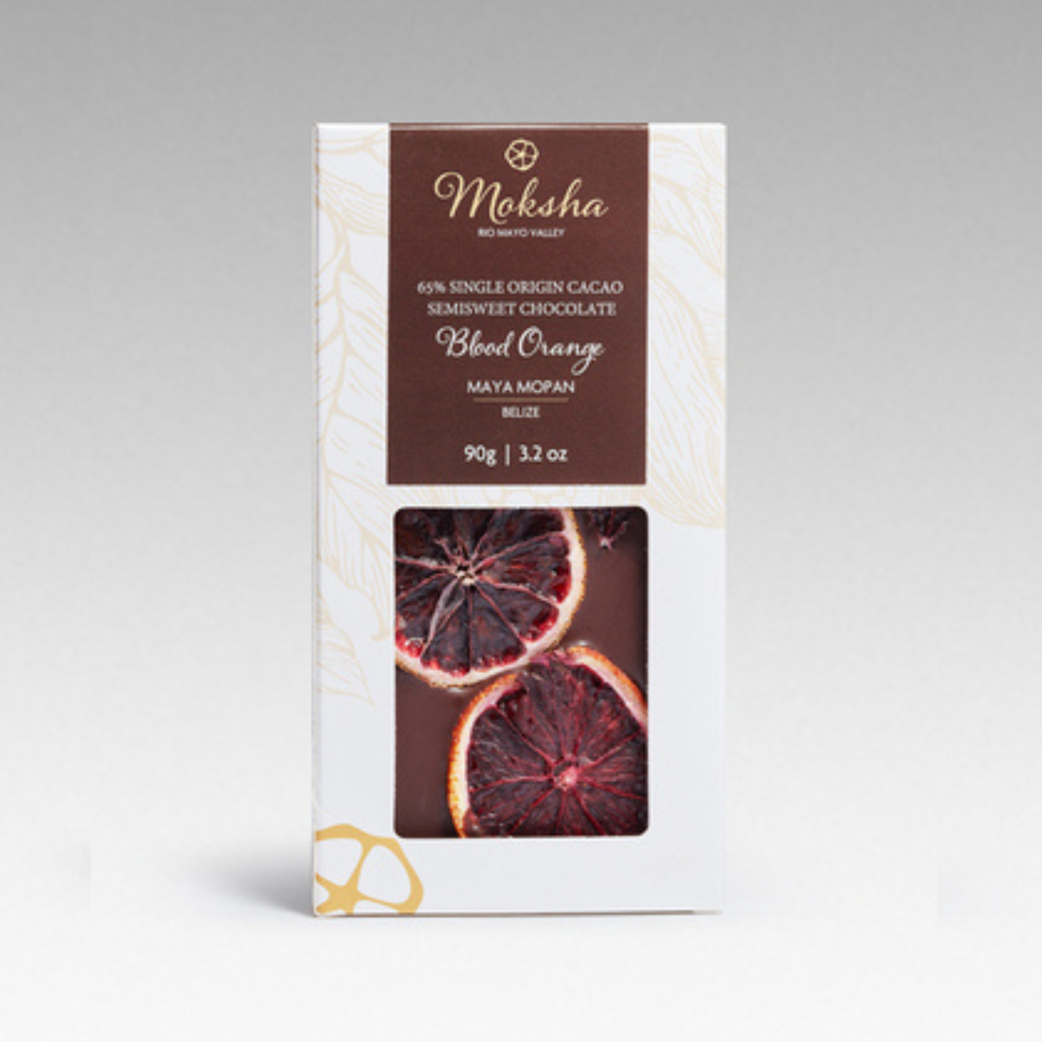 Moksha Blood Orange chocolate bar packaging on a gray background