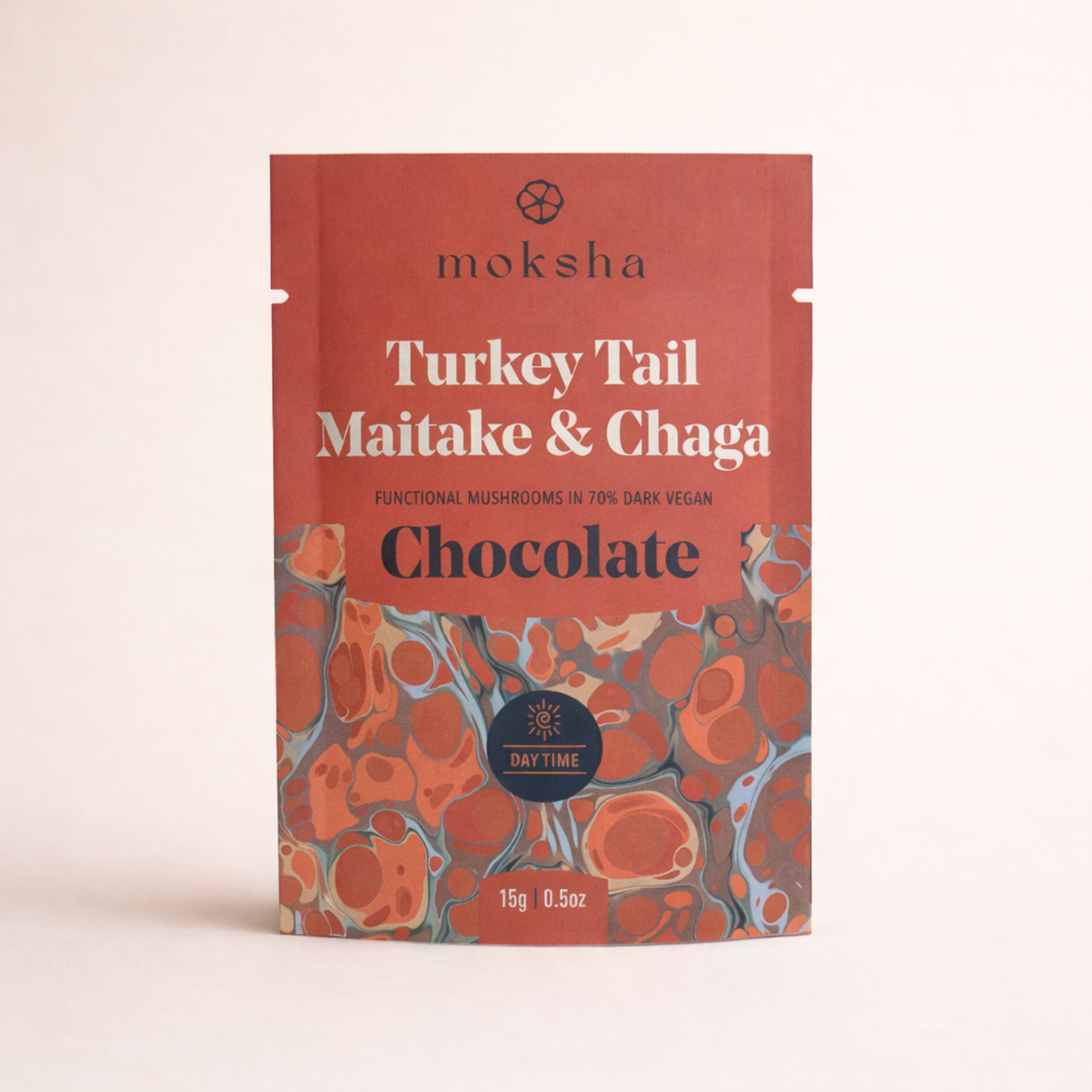 Moksha Turkey Tail Maitake & Chaga functional mushroom chocolate pouch, 70% dark vegan chocolate, daytime blend packaging on a light neutral background.
