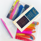 Moksha Zorzal Estate 70% Single Origin Dark Chocolate Bar paired with abstract art greeting cards and pink pen – premium chocolate gift set for birthdays, anniversaries, or thoughtful notes.