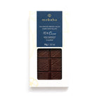 Moksha 70% Cecao single-origin dark chocolate bar from Ecuador with perfectly tempered dark chocolate visible through white and gold packaging.